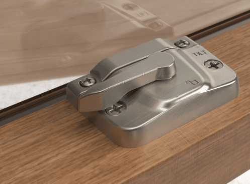Satin nickel lock on a dark oak woodgrain window